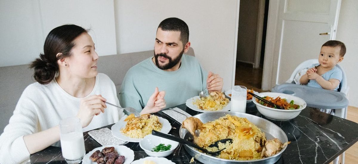 A family sharing a meal at home, highlighting connection and togetherness.
